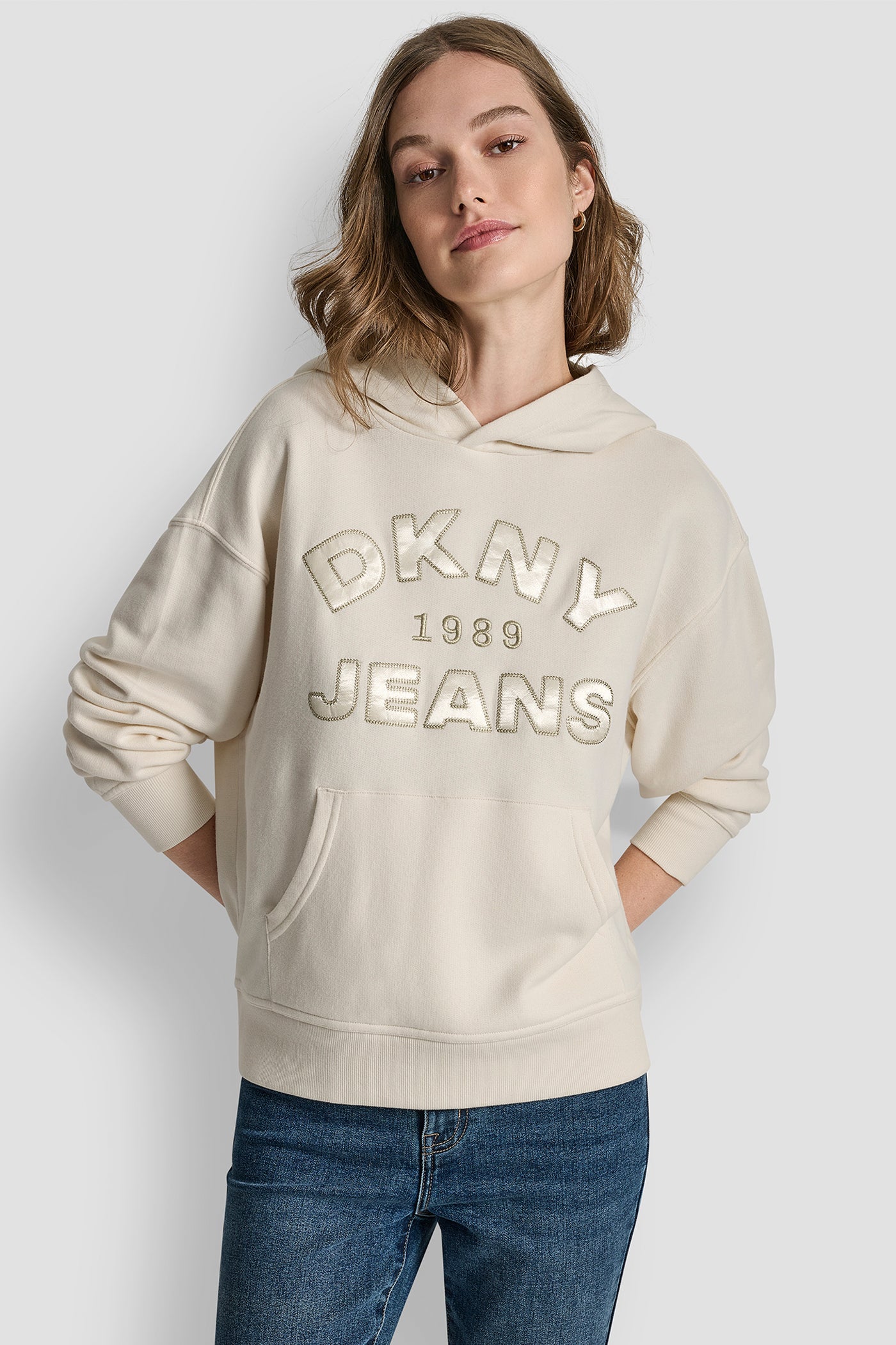 EGGNOG/CHAMPAGNE DKNY JEANS SATIN APPLIQUE CHAINSTITCH LOGO SWEATSHIRT, FRONT VIEW | Clothing