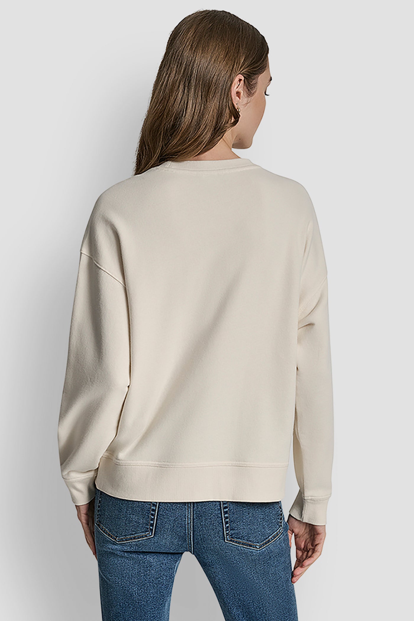 EGGNOG/LIGHT GOLD DISTRESSED DKNY FOIL LOGO SWEATSHIRT, BACK VIEW | Under $75