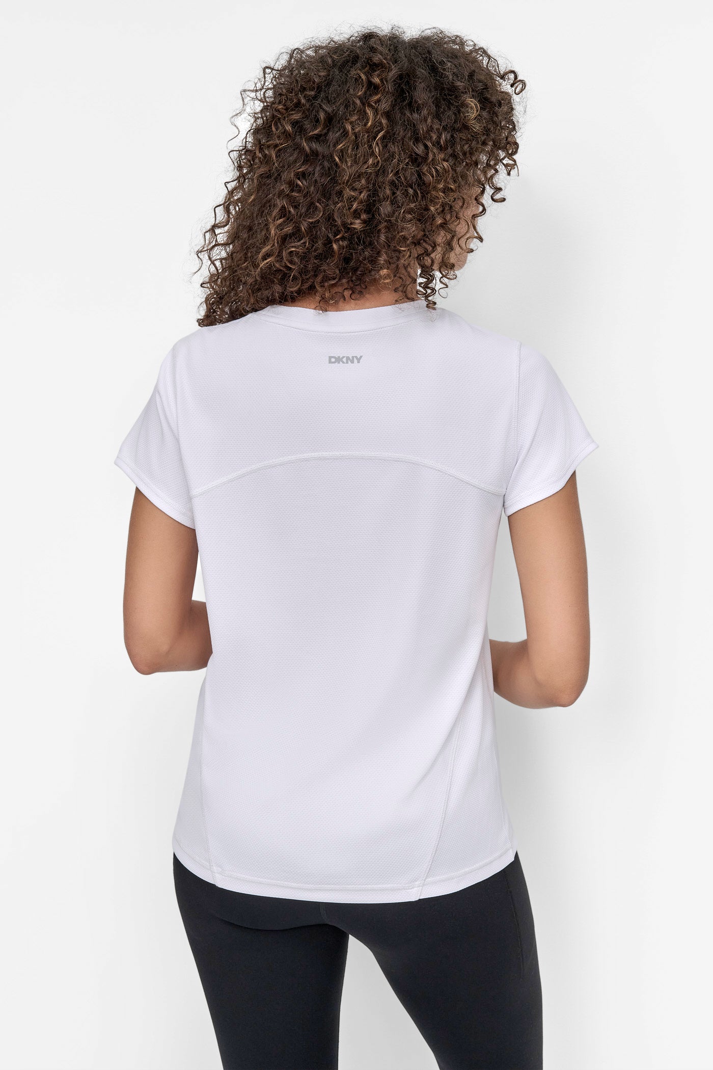 White REFLECTIVE LOGO TECH TEE WITH SEAM DETAILS, BACK VIEW | Tees & Tanks