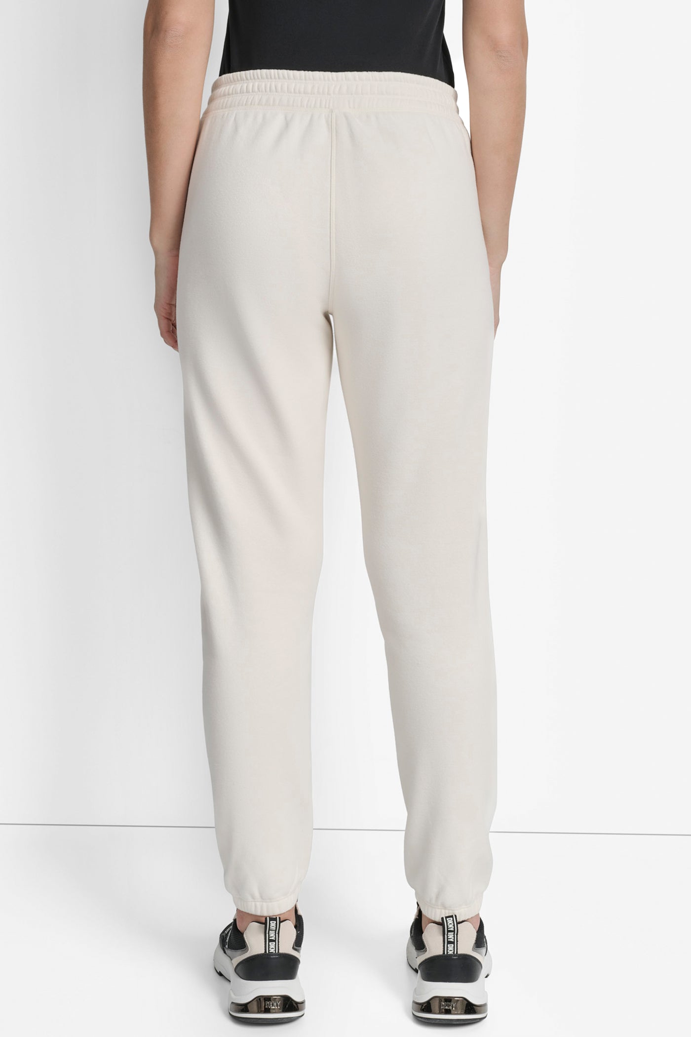 EGGNOG SILICONE LOGO RELAXED JOGGER WITH POCKETS, BACK VIEW | Sport Essentials