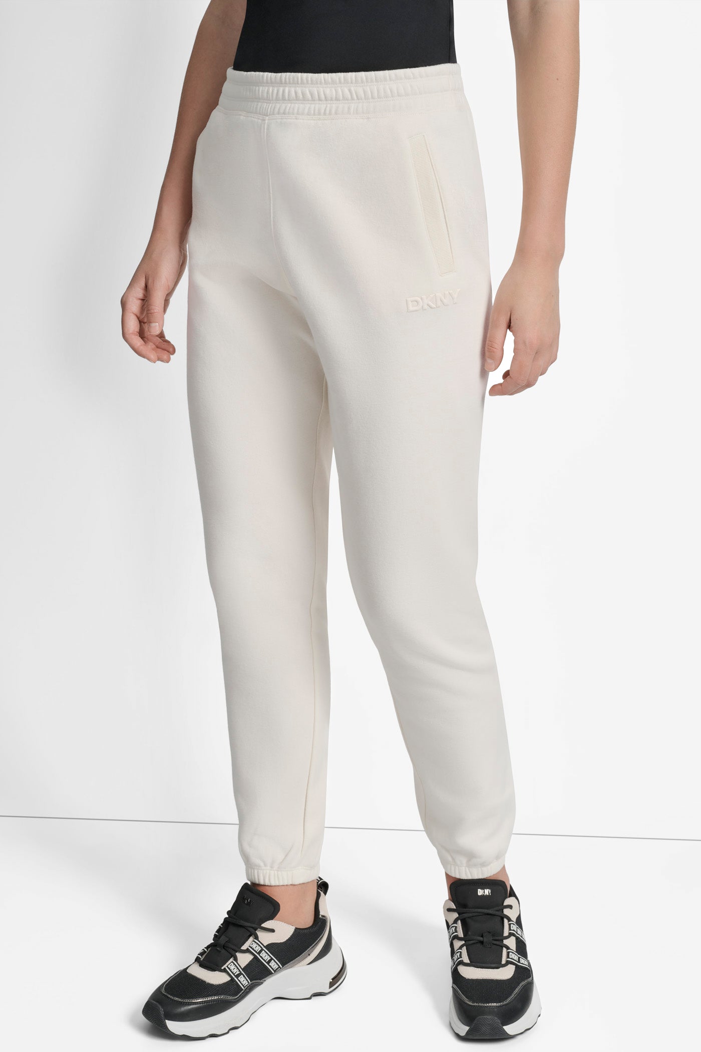 EGGNOG SILICONE LOGO RELAXED JOGGER WITH POCKETS, FRONT VIEW | Sport Essentials