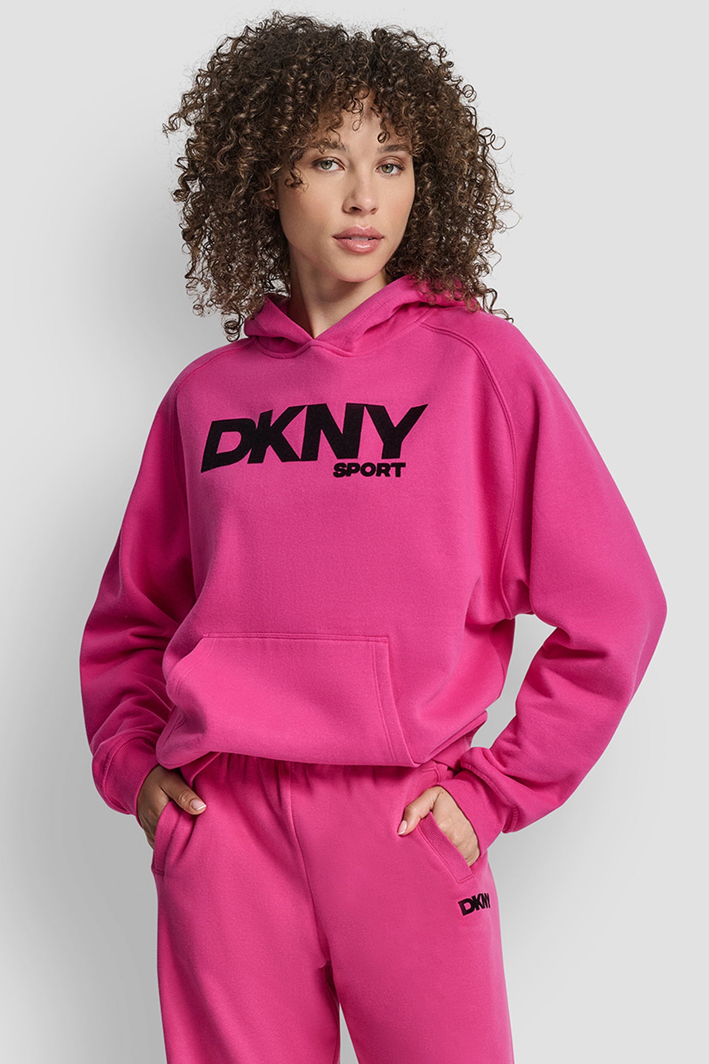 FESTIVE PINK OVERSIZED FLOCKED LOGO PULLOVER HOODIE, VIEW 1 | DKNY Sport
