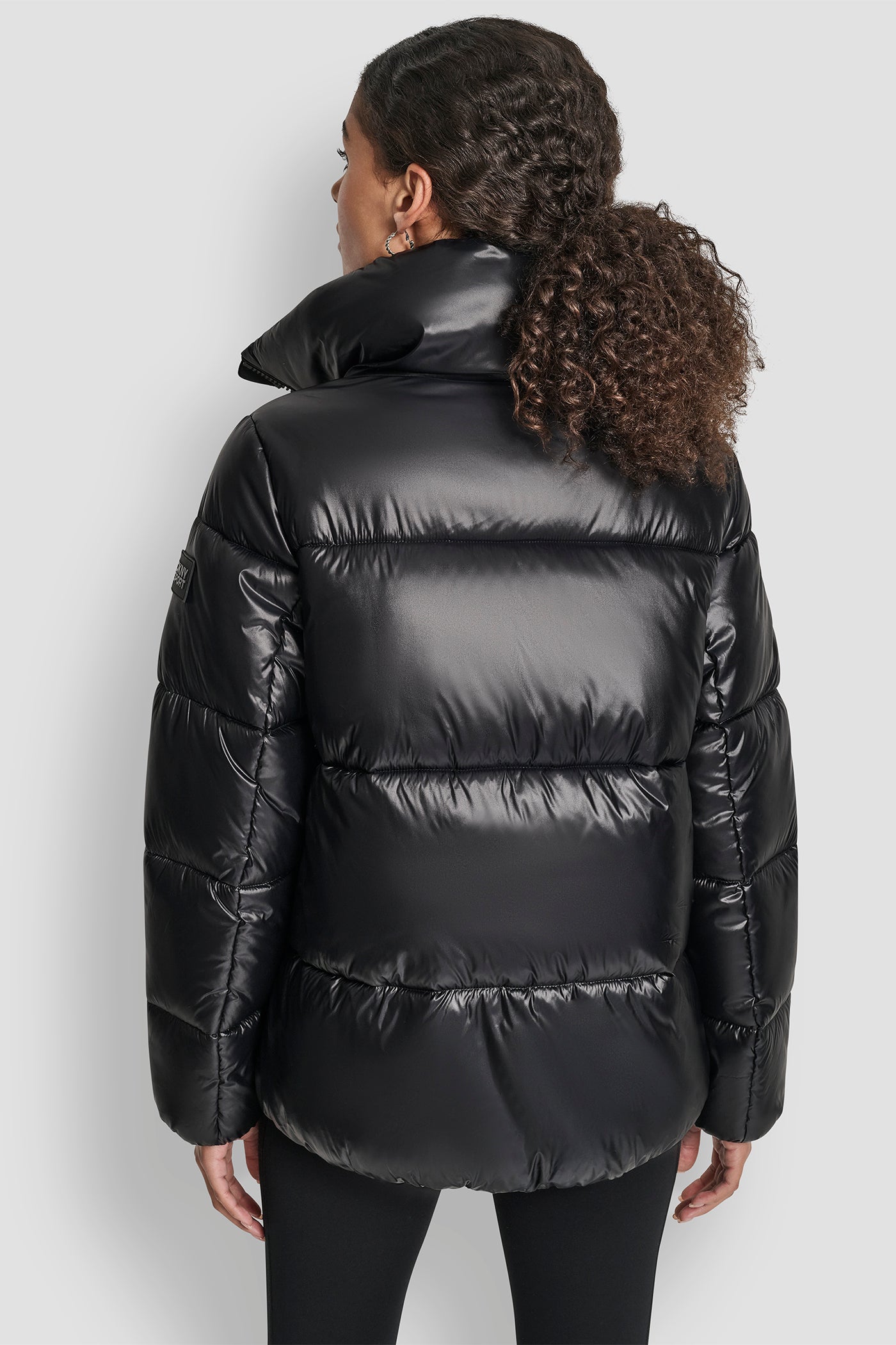 METALLIC BLACK QUILTED PUFFER WITH OVERSIZED COLLAR AND INTERIOR PLACKET LOGO, BACK VIEW | WOMENS COATS & JACKETS