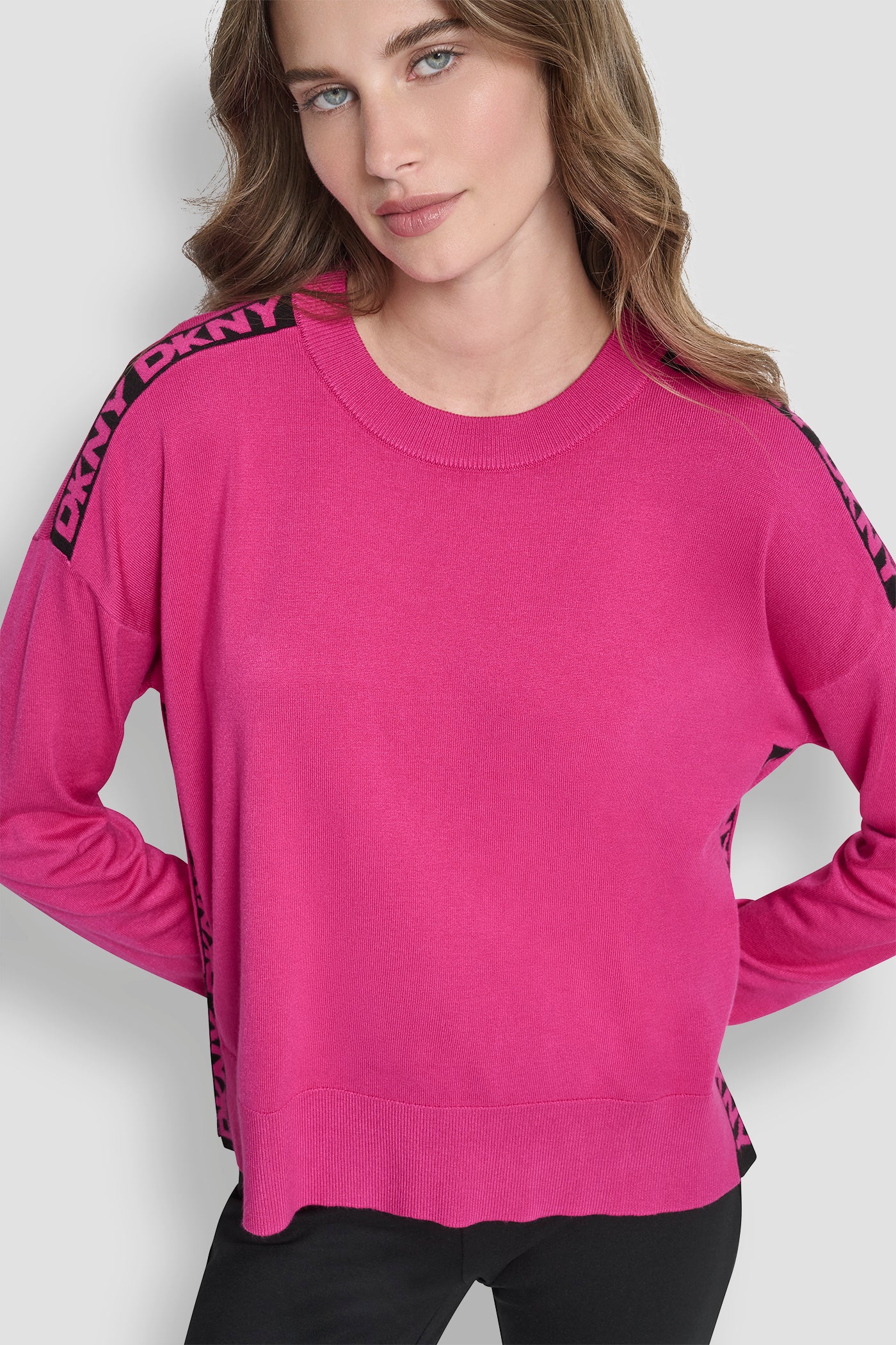 FESTIVE PINK LONG SLEEVE LOGO TAPE SWEATER, BACK VIEW | Back-To-School Shop